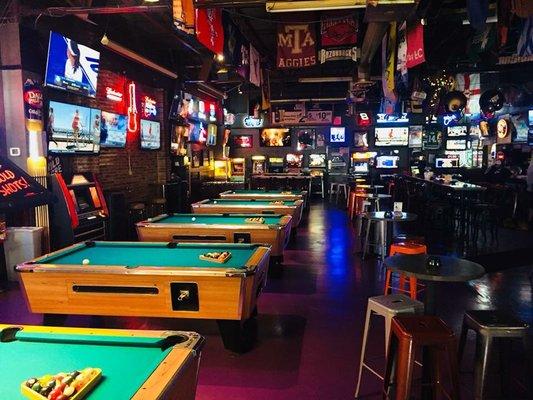 5 pool tables, golden tee, buck hunter and vintage arcade games like Mrs Pac-Man, donkey Kong, dig dug,  shuffleboard and Comet pinball