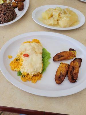 Yellow chicken rice with cheese and plantains