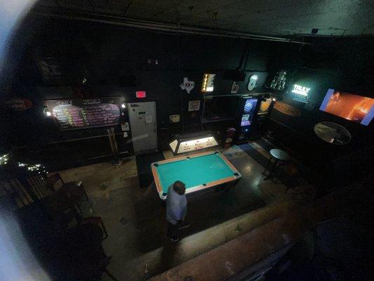 View from the seating area upstairs of the pool table area