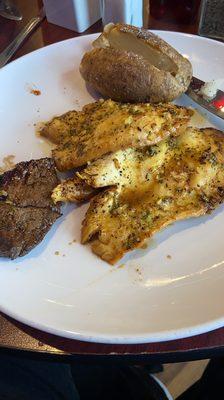 Lemmon pepper chicken, baked potatoe and a piece of sirloin steak