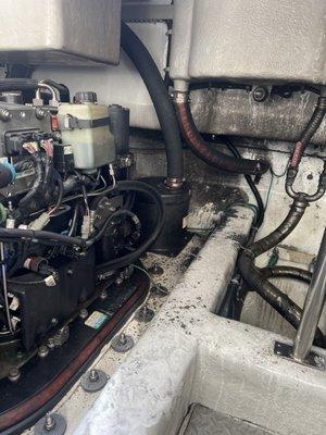 Condition of engine room after improperly secured exhaust hose blew off while underway.