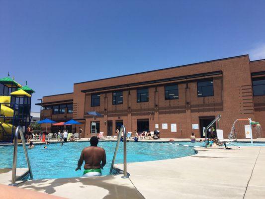 Slides, showers, tables, lounge chairs, life guards, and spare life vests. Got everything we need for the opening day of the pool!