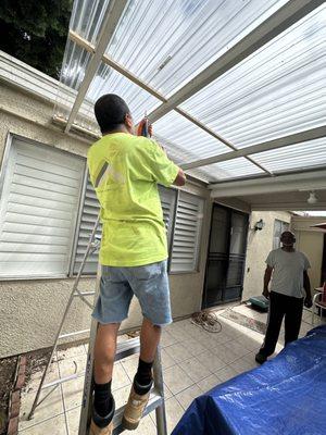 Eric working on some additional patio roofing for a customer specializing in roof repair