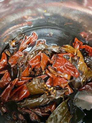 Simmering the dried chilies before blending them to be the base of our barbacoa rub