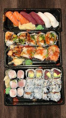 From top to bottom: Salmon, bluefin tuna, white tuna Shrimp tempura, tiger roll  Yellowtail scallion roll, Alaskan, bluefin tuna avocado