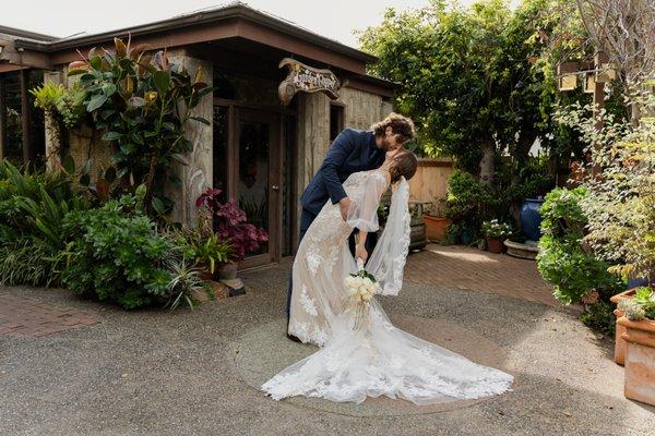 deep kiss in front of the chapel entrance