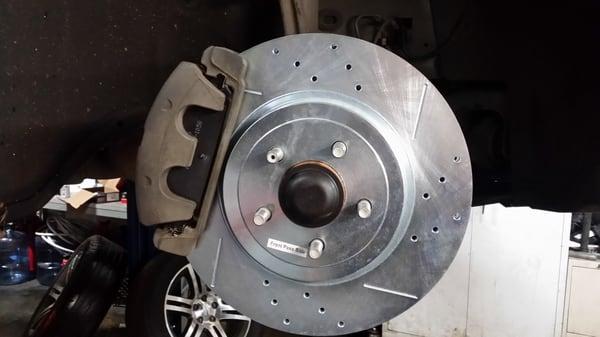 Upgraded brake rotors. Slotted and drilled rotors