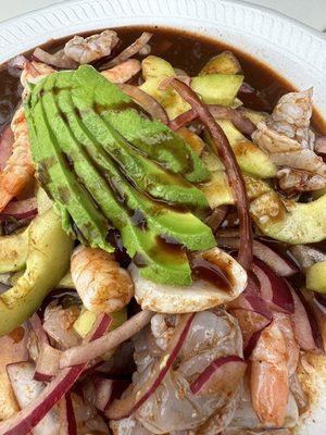 Shrimp, scallops, onions, and avocado