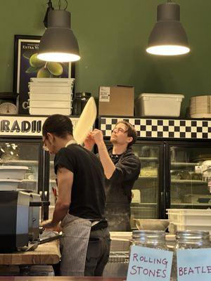 Watching Ryan, the "Shop Manager and Pizza Perfectionist" toss the dough.