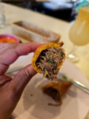 The filling inside of the oxtail patties