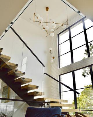 Custom staircase in Del Mar home featuring Monarch Plank hardwood