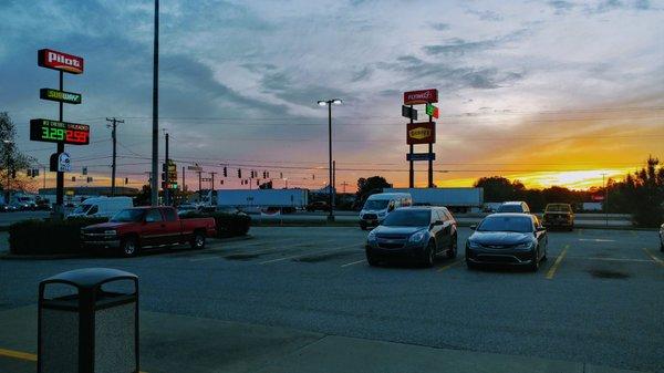 looking out from the Taco Bell side towards the Flying J across the street and the Loves kitty corner at sunset