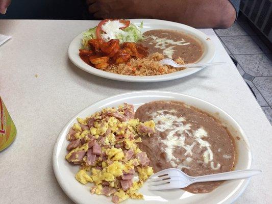 Camarones a la diabla and huevos con jamon. Dishes are served with handmade tortillas, frijoles, and arroz.