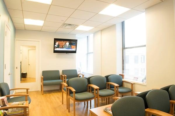 Our bright, clean waiting room offers plenty of seating and a flat screen TV.