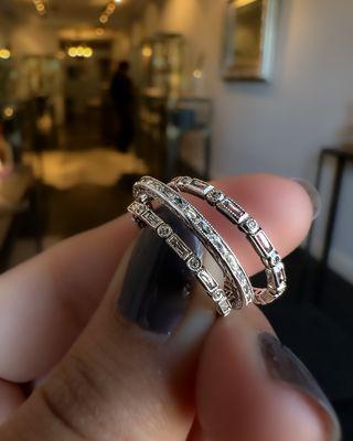 French cut baguette diamonds, with round stones are set in these delicate bands. By Catherine Angiel NYC