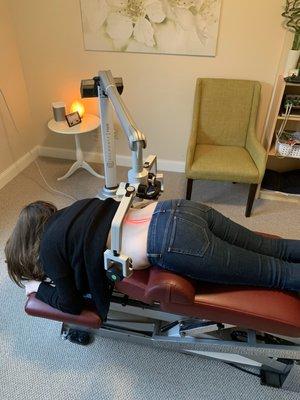 A patient using the FX635 laser for back pain.  This laser is FDA approved to treat pain anywhere in the body.