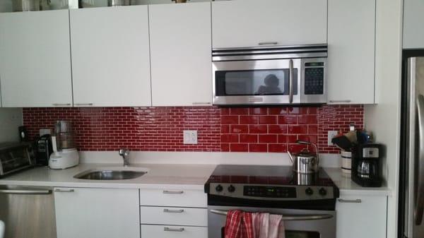 Red glass tiles for kitchen backslash.  Great job on price,  installation,  and service.