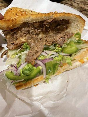 Philly cheese steak sandwich dressed as ordered.