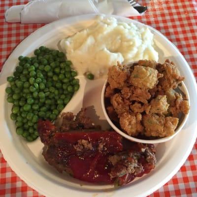 Lunch special, meatloaf with mashed potatoes, peas and fried okra.