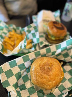 Front - Philly Cheesesteak Burger on a gluten-free with Vegan Cheese Fries and an El Classico Vegan Burger with seasoned fries