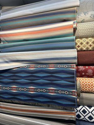 Look at the quality and color of these fabrics. Just one of the many many walls full!