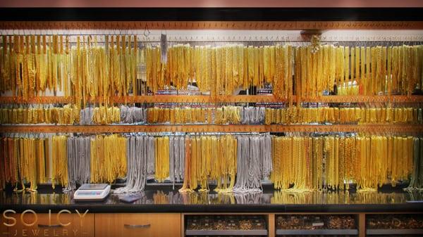 Our new showroom floor wall filled with hundreds of real gold chains.