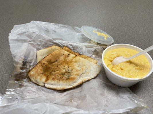 Cheese pita toast with sausage link. Cheese grits.