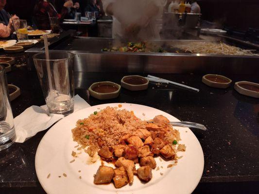 Chicken with fried rice.  Our veggies are on the grill top in the background.