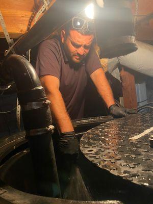 Technicia Manny, 
 Working on a sump pump.