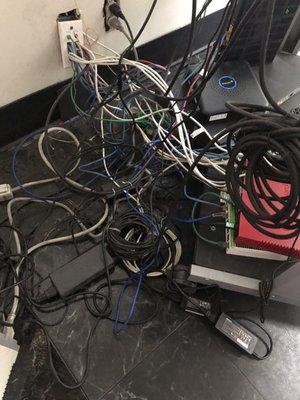 In the process of moving this mess into a raised untangled patch panel.