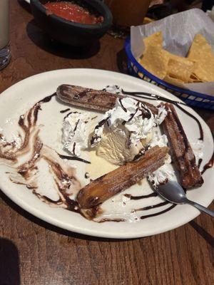 Churros with ice cream!   Already started eating it!! Love this place and the food! Always amazing staff every time I come!