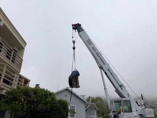 Crane Job over two roofs tops in Laguna Beach