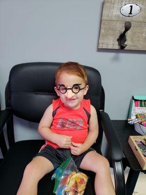 Evan waiting patiently while Granni gets her therapy.