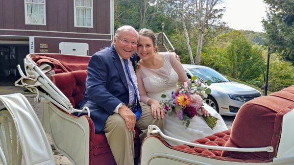 Father and daughter in carriage going to ceremony