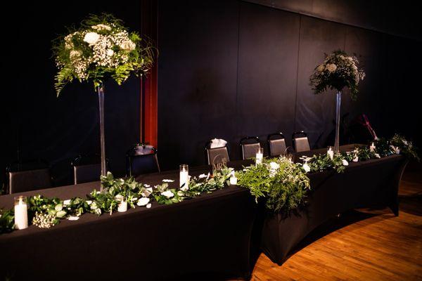 Head table with chalkboard wall.