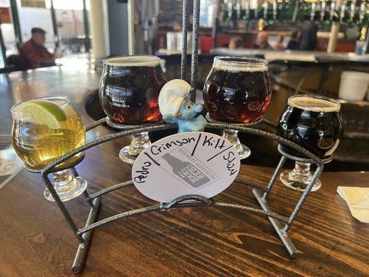 Gutsy helping with a flight of various beers