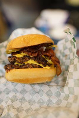 This burger was so good.  Note that it's a tall stack.  I had to squish the buns together to make this bite-able.