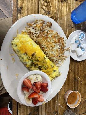 Ranchero omelette bananas and strawberries and hash browns.