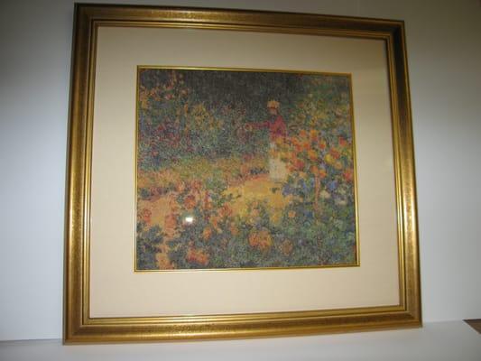 Needlework presented in custom frame with linen and gold fillet.