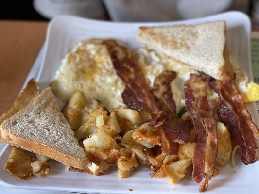 2 fried eggs, home fries (super under seasoned), and CRISPY BACONNN