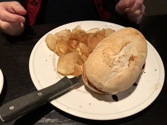 Chicken mozzarella ciabatta sandwich with potato chips