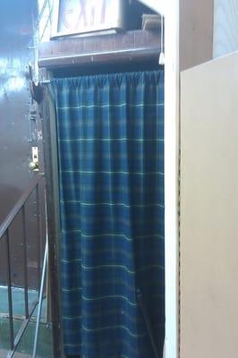 This is one of the fitting rooms, behind the curtain