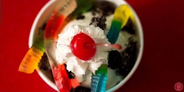 Cup of Frozen Custard with Gummy Worms, Whipped Cream, and Cherry on top