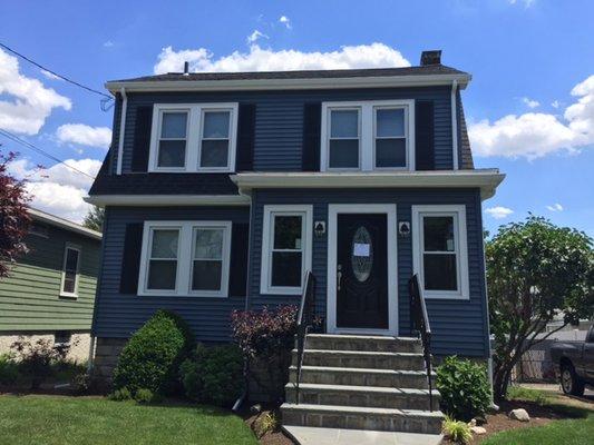 Pacific Blue Monogram Siding with PVC trim, new Therma Tru entry door and Charcoal Black CertainTeed Landmark Roof Roof