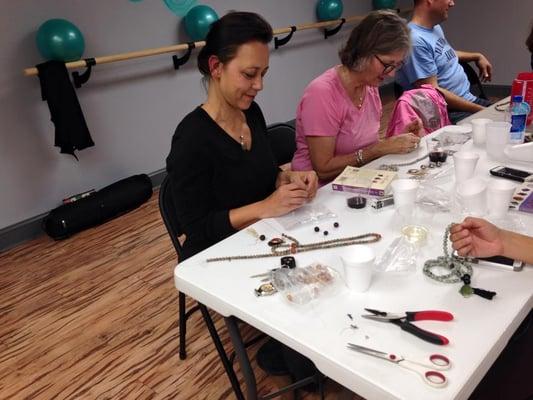 Some of our members creating Malas, or meditation beads, on a Friday evening!