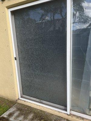 Shattered patio door glass.