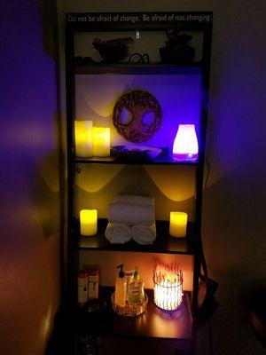 Himalayan salt lamp, aromatherapy diffuser, candles, and towels. Setting the area for relaxation and rejuvenation.