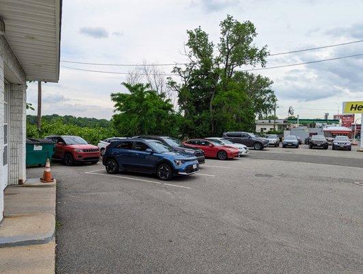 Parking lot of cars shortly before closing.