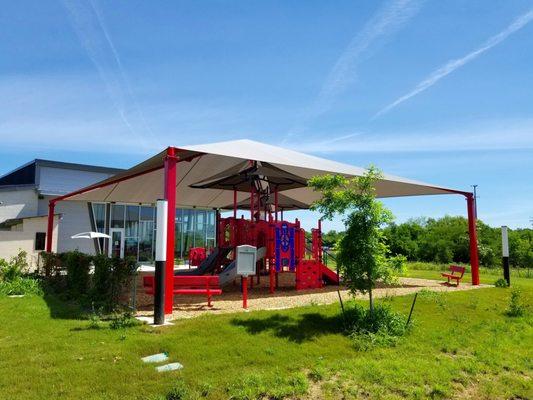 This 4-post structure at Schaefer Libary in San Antonio is covering their playground outside.