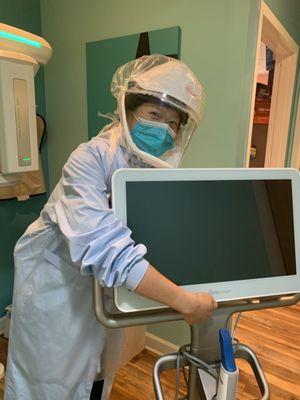 Our lovely hygienist, Joy, giving our Itero scanner a hug!